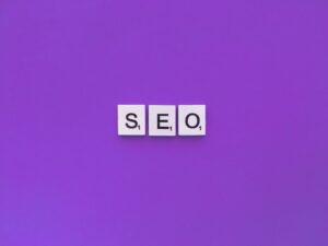 SEO scrabble letters word on a violet background.